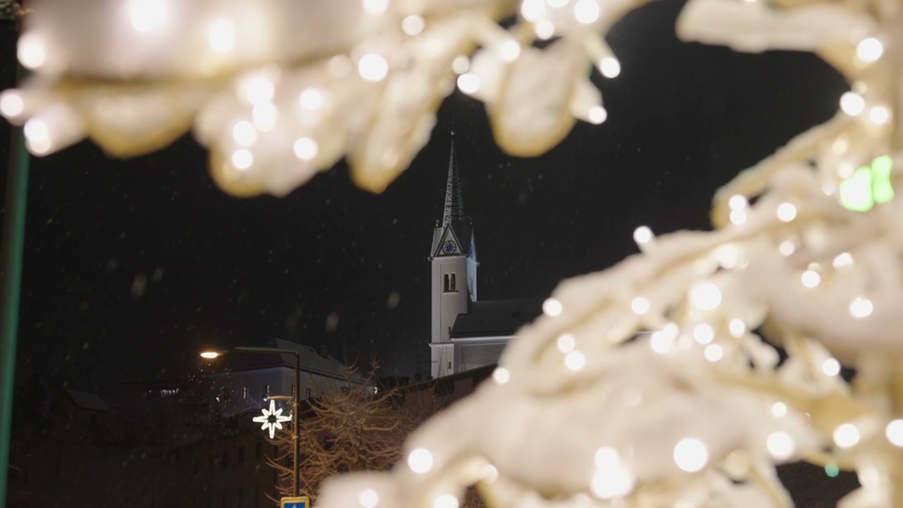Snowing Church Steeple with Christmas Lights
