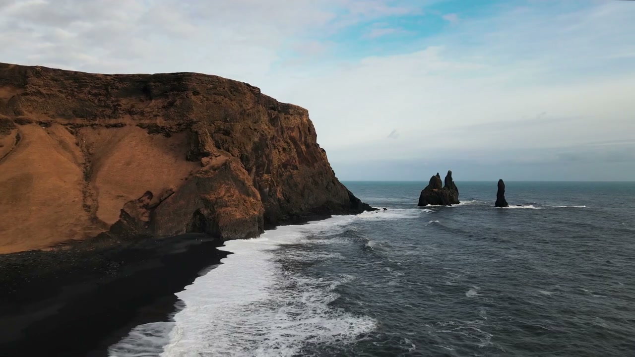 Iceland Black Sand Beach with Sea Stacks • Stock Video on Uppbeat