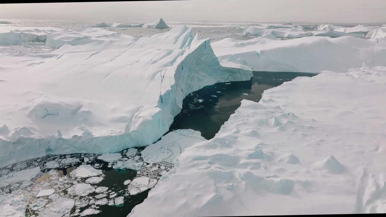 Aerial View of Ilulissat Icefjord Icebergs, Greenland • Stoc…