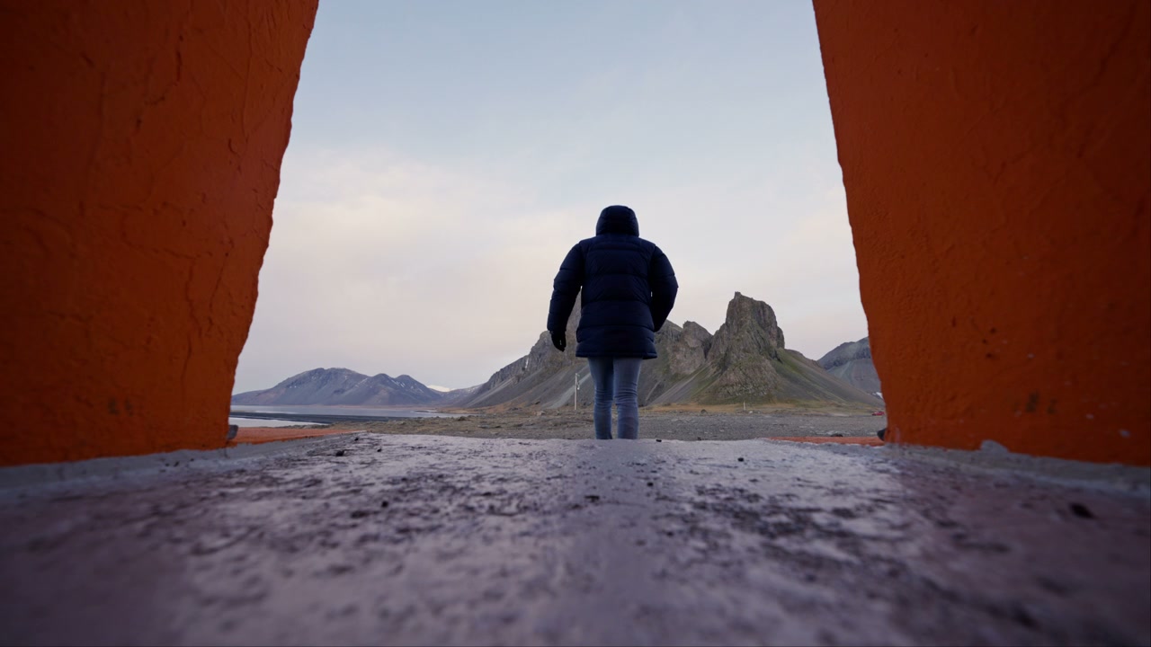 Person Walking to Icelandic Mountain Peaks