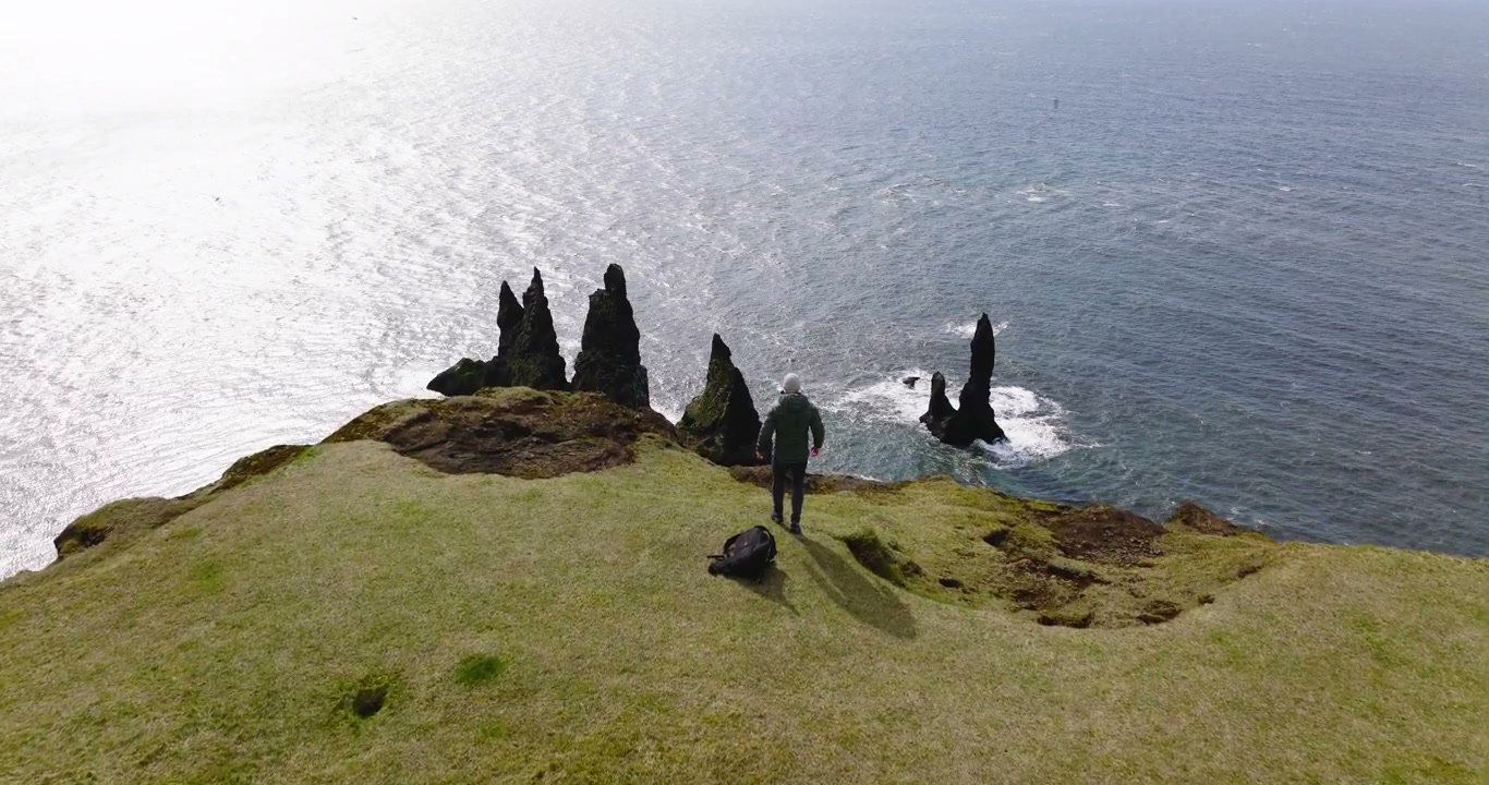 Person Walks Towards Reynisdrangar Sea Stacks