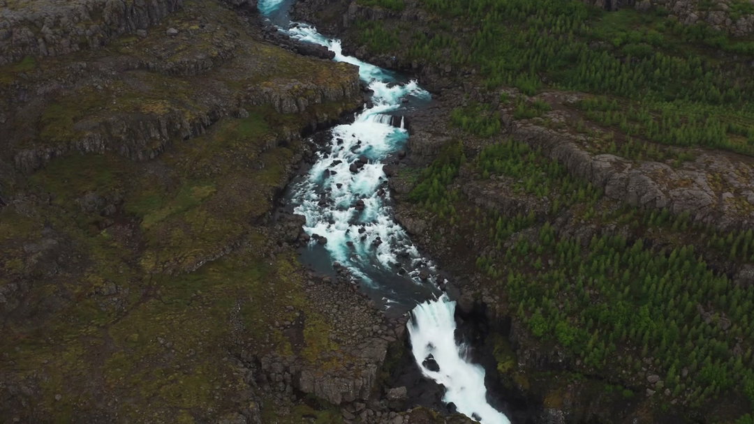 Aerial River Flowing Through Rocky Canyon • Stock Video on Uppbeat