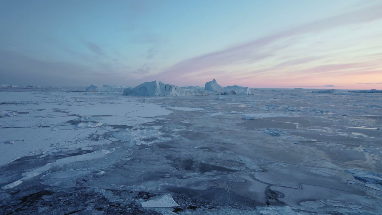 Polar Landscape with Icebergs at Sunset