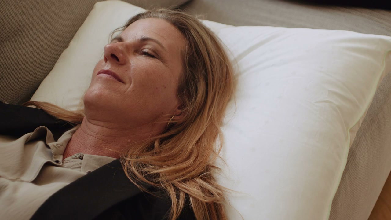 Businesswoman Napping on Sofa