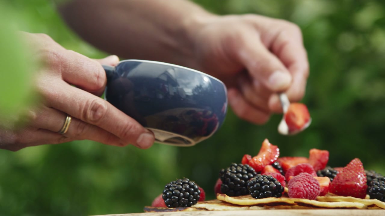Preparing Pancakes with Fresh Berries