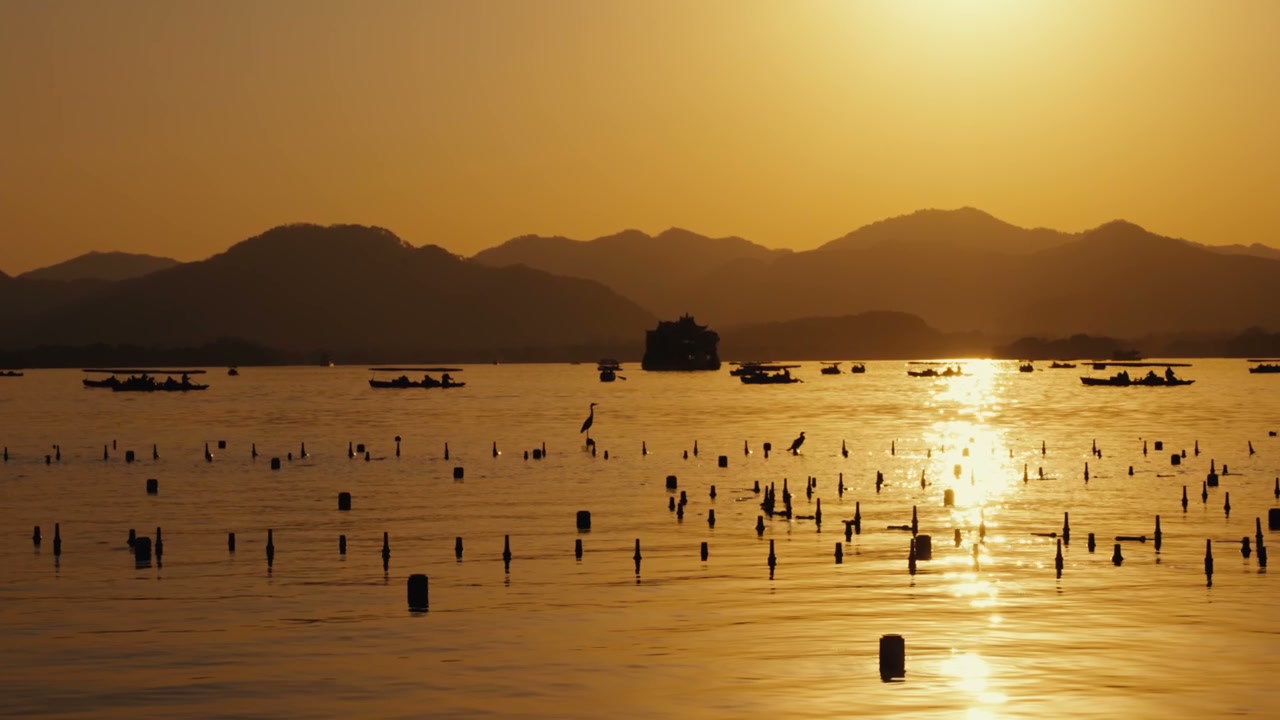 Sunset on West Lake with Mountains and Boats