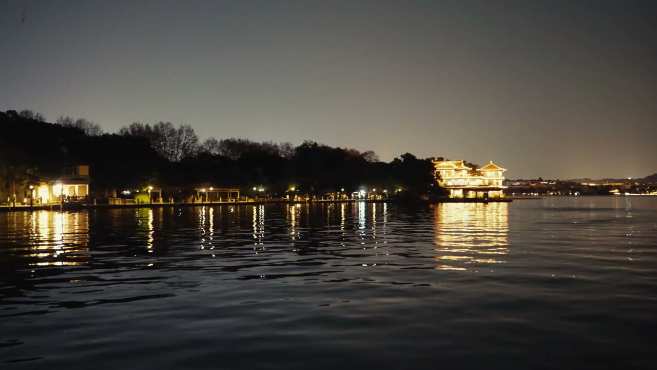 Illuminated Buildings on West Lake at Night