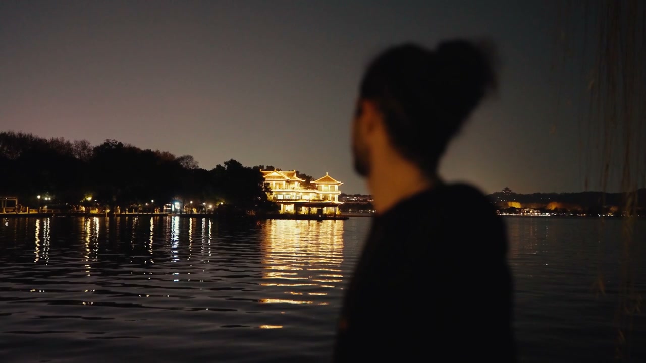 Illuminated Building on Hangzhou Lake at Night