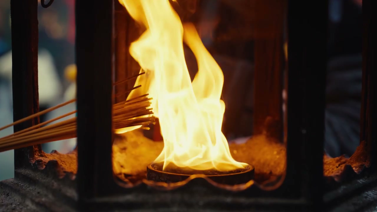 Person Lighting Incense Sticks