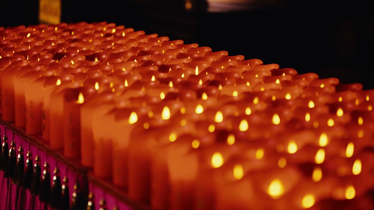 Rows of Flickering Ceremony Candles