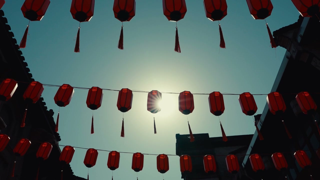 Red Chinese Lanterns Hanging Over Street