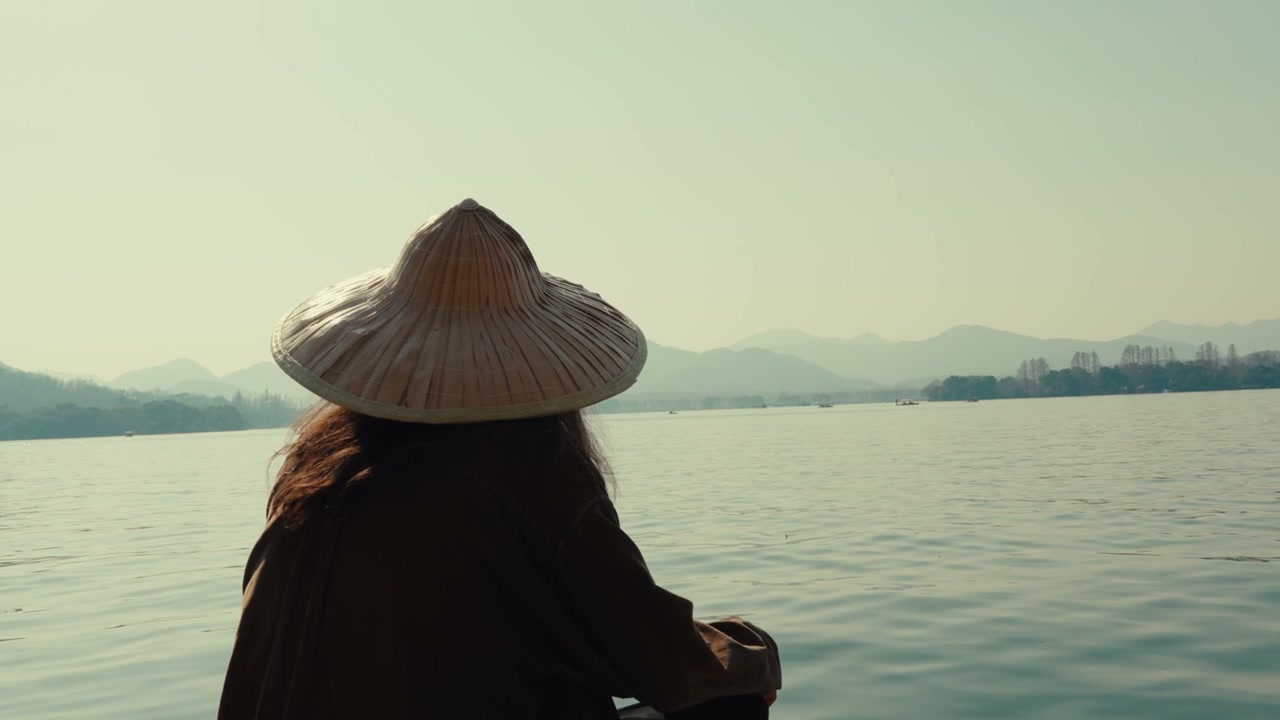 Person in Conical Hat on West Lake