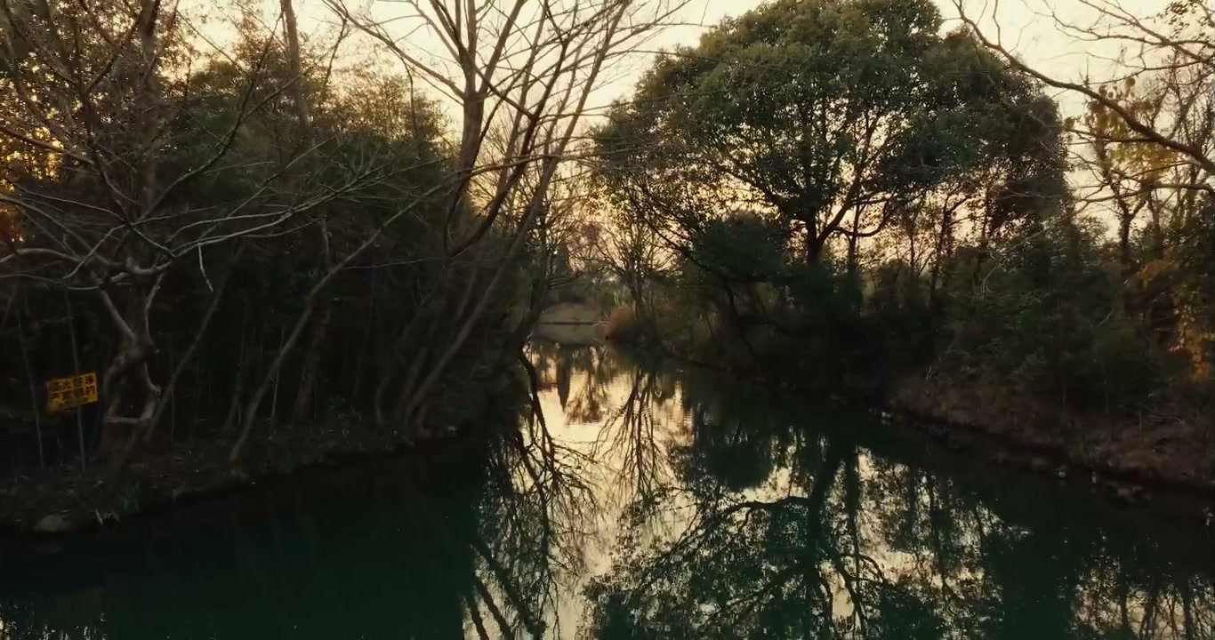 Smooth Glide Over Serene Canal at Golden Hour