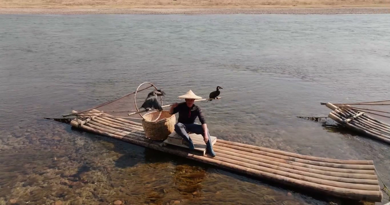 Yangshuo Cormorant Fisherman on Bamboo Raft