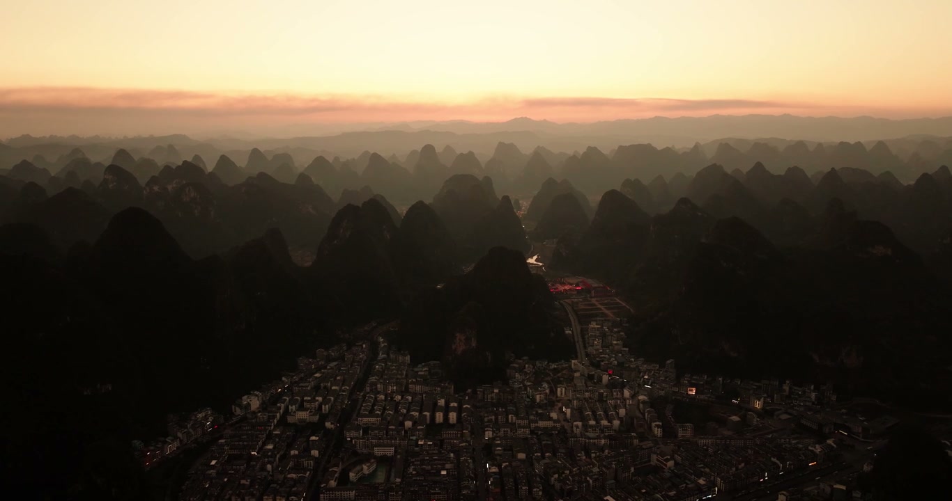 Sunrise over Yangshuo Karst Mountains and City