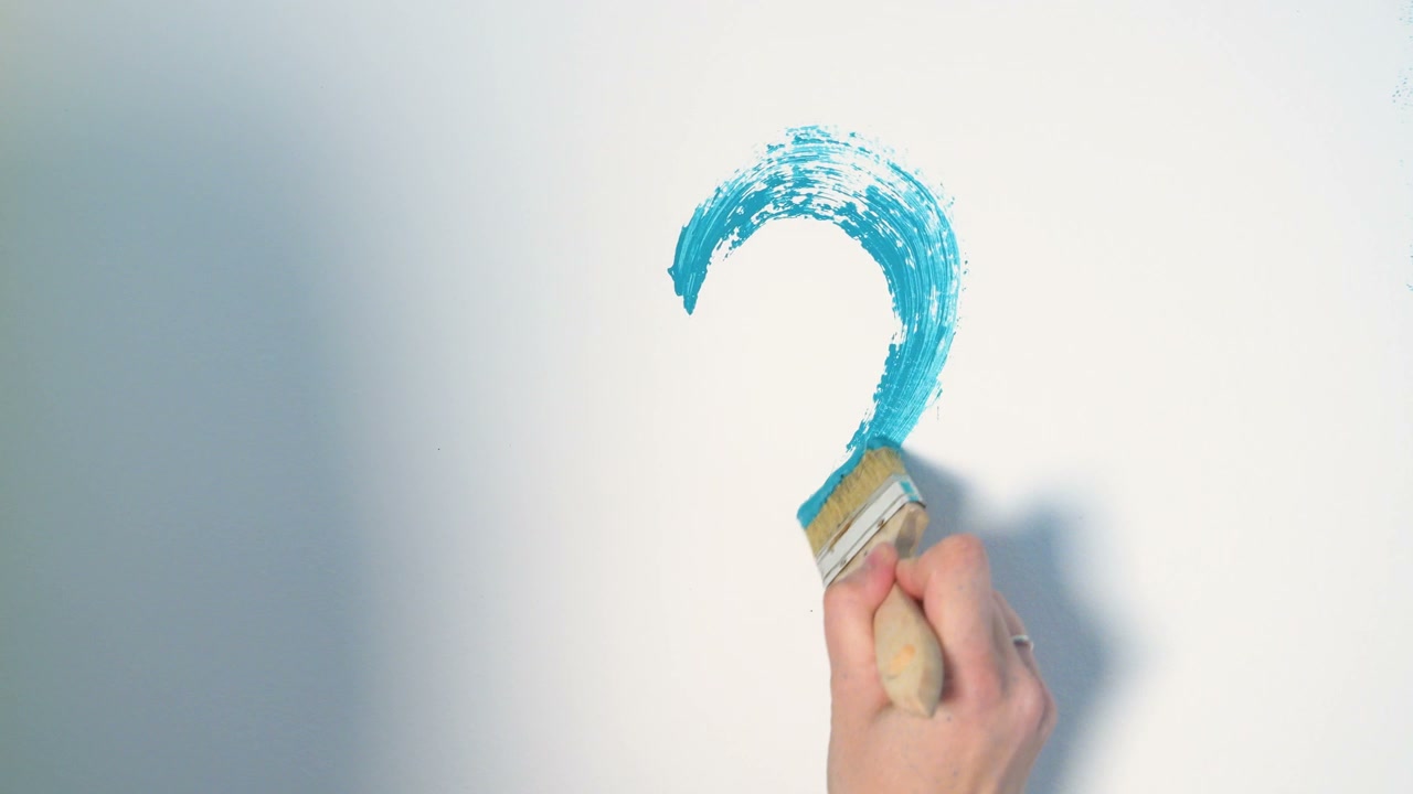 Hand Painting Blue Heart on White Wall