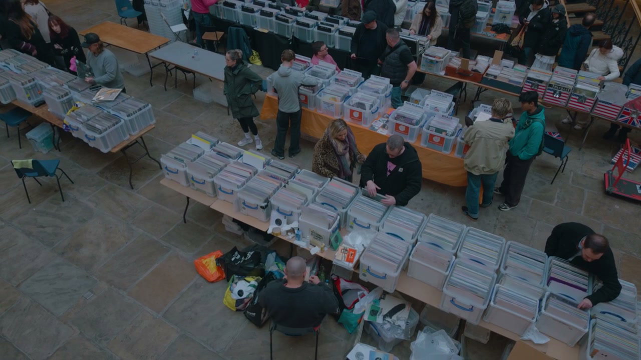 People Browsing Vinyl Records at a Market