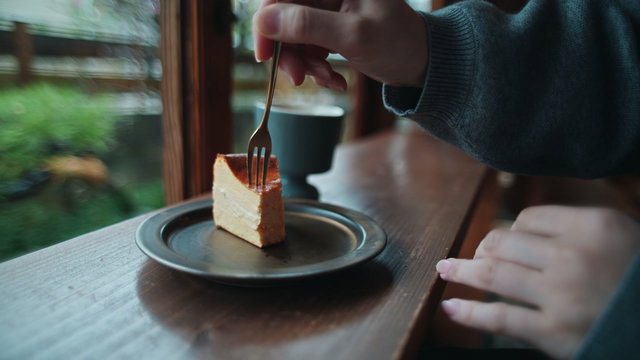 Person Eating Sweet Pastry in a Cafe • Stock Video on Uppbeat