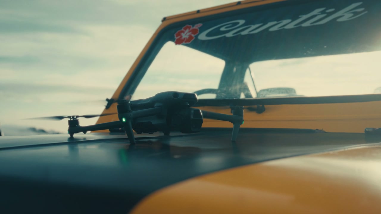 Drone With Spinning Propellers On Car Hood