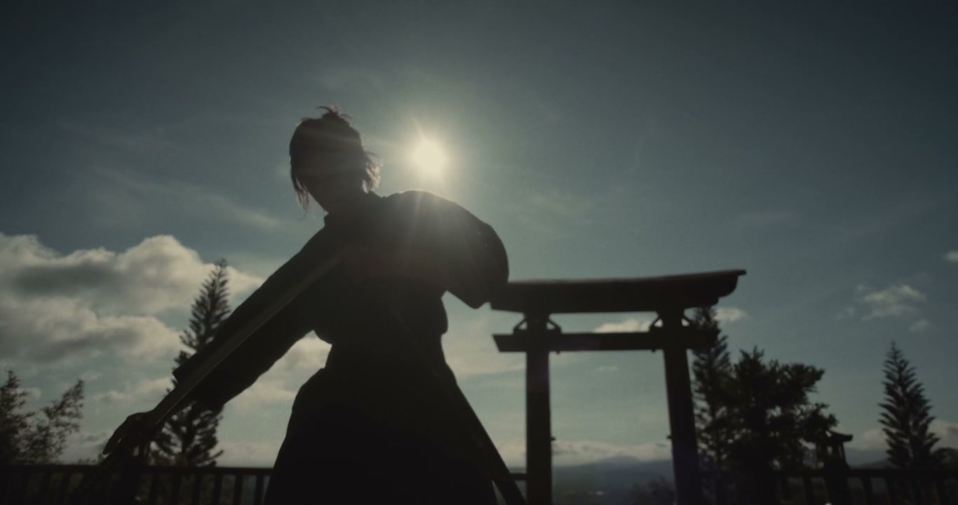 Samurai Drawing Katana Against Sun