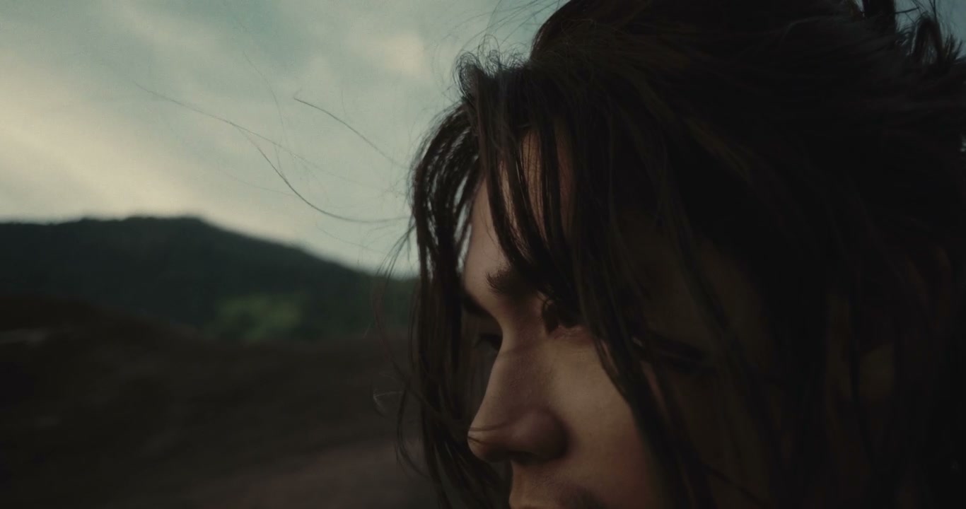 Person with Long Hair Opening Eyes