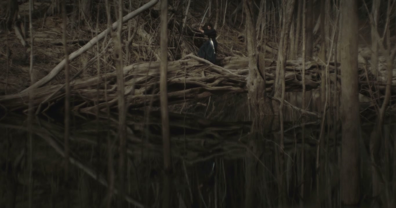 Samurai Warrior Practicing with Katana in Forest
