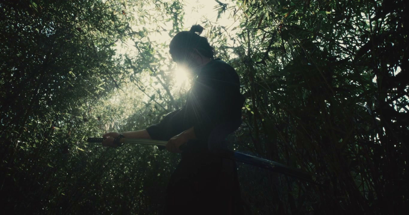 Samurai Drawing Katana in Bamboo Forest