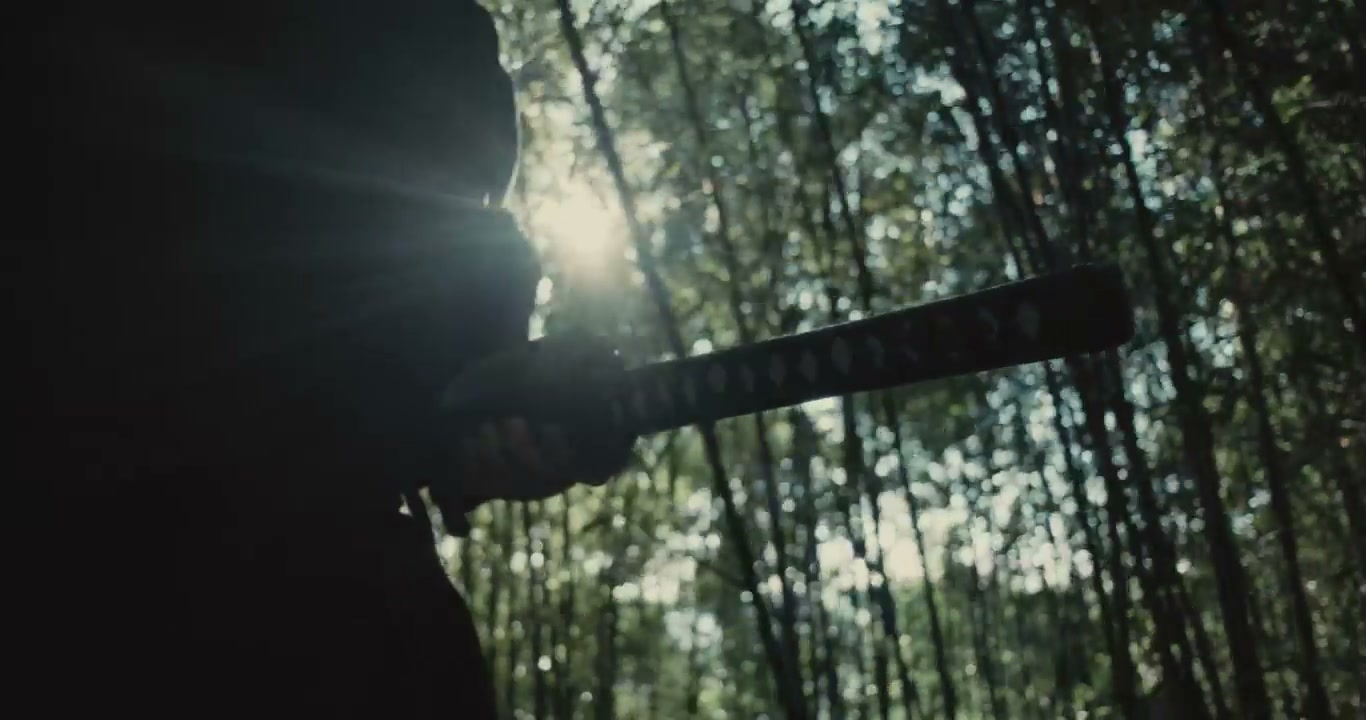Samurai Drawing Katana in Bamboo Forest