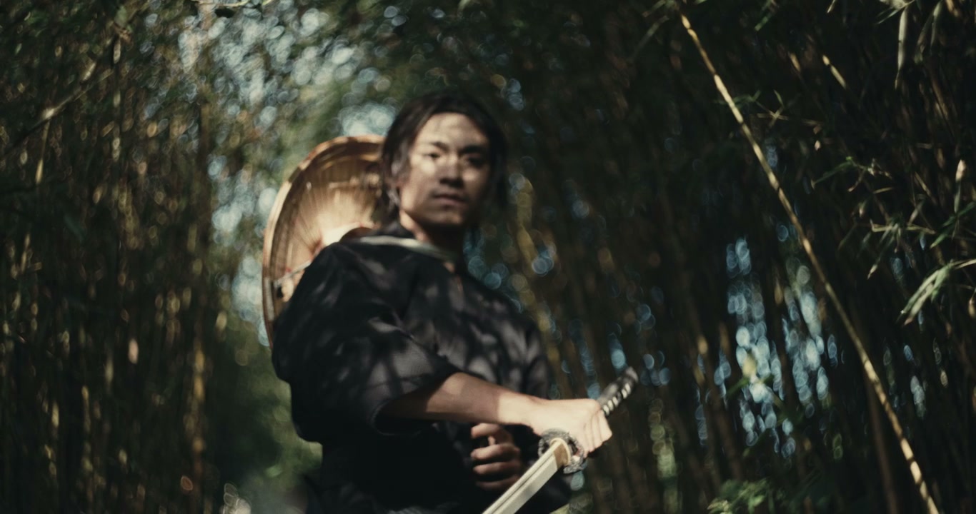 Samurai Warrior Draws Katana in Bamboo Forest