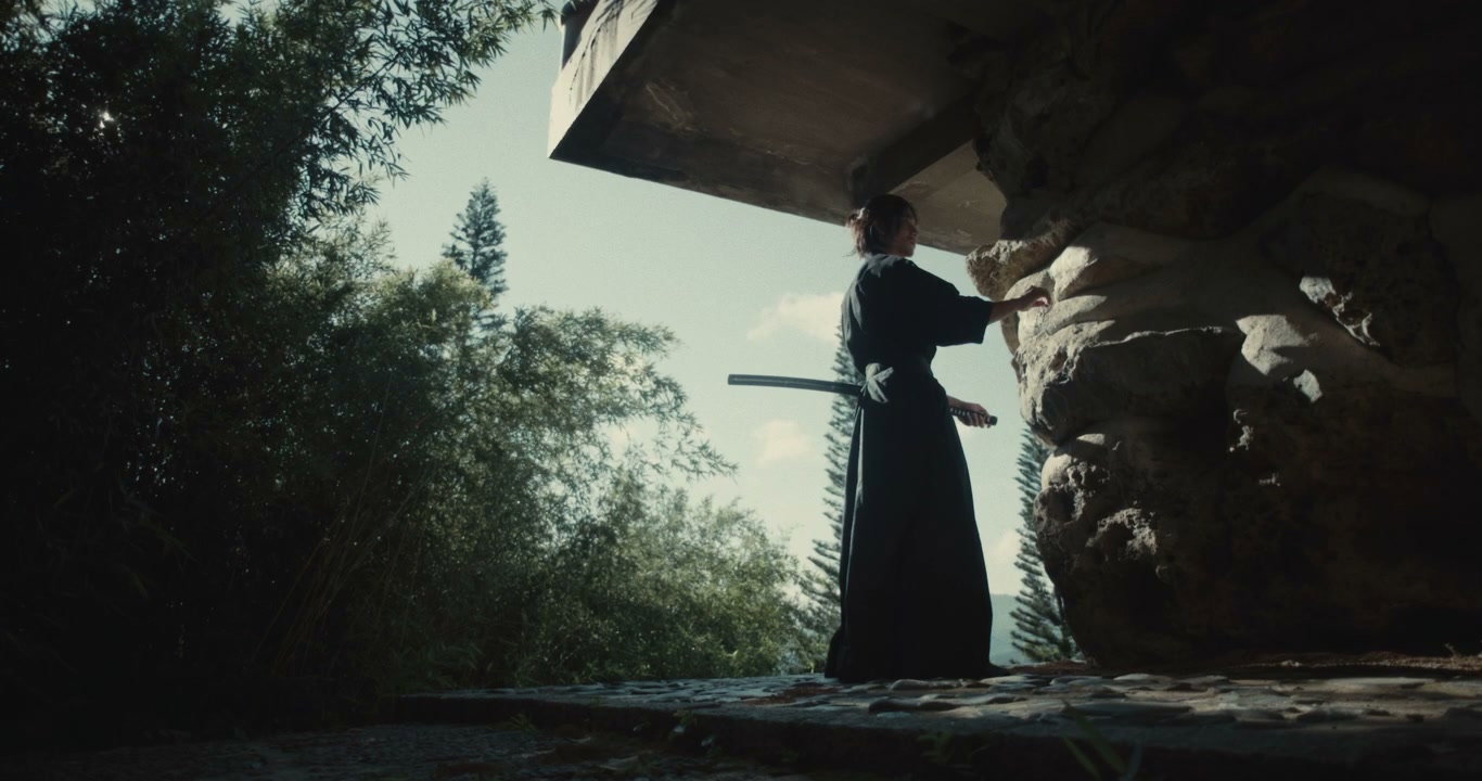 Samurai Touching Rock Under Overhang
