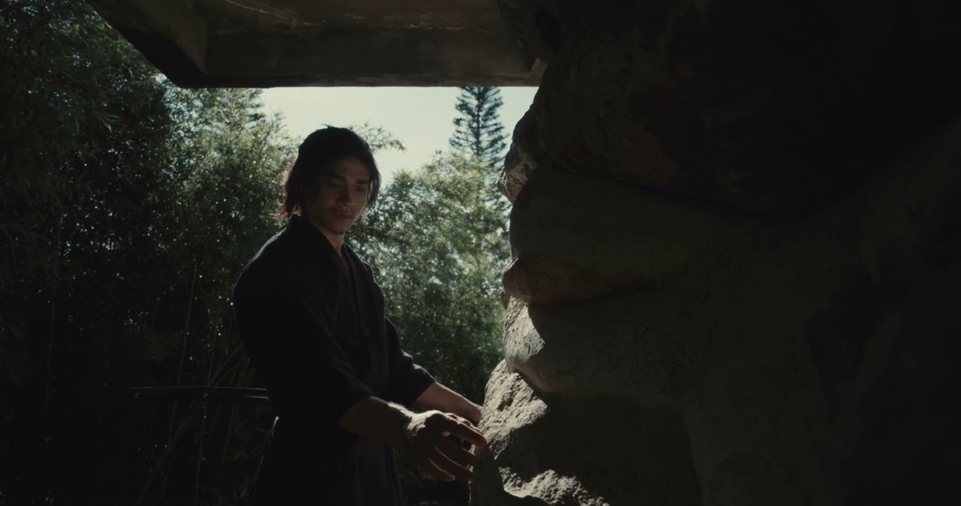 Samurai Standing with Katana by Stone Structure