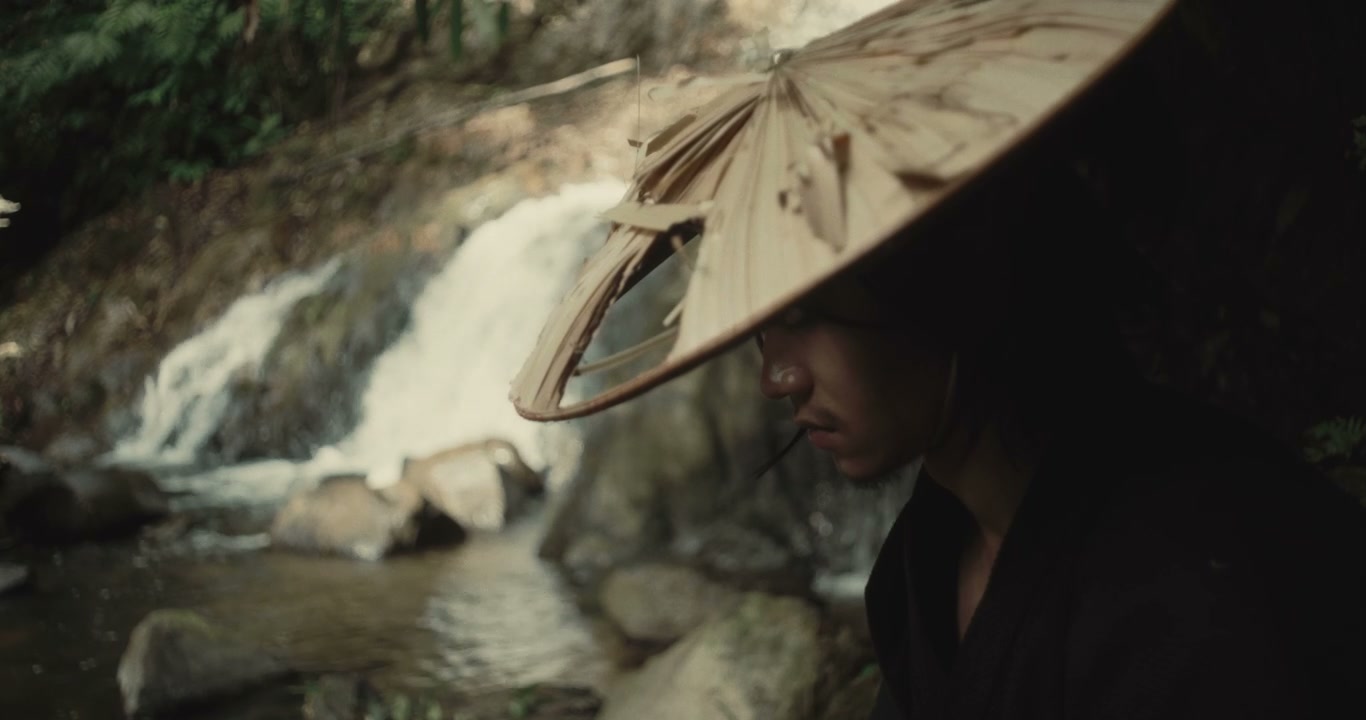Pensive Samurai Figure by Jungle Waterfall