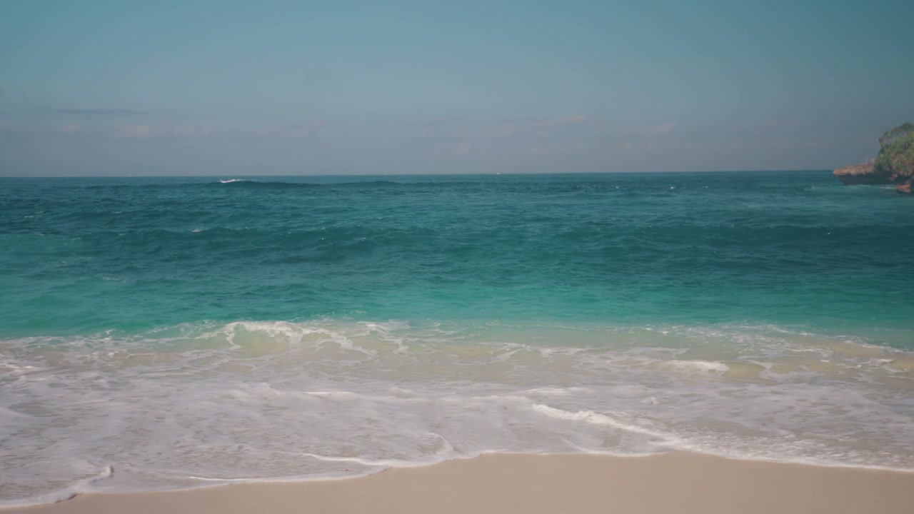 Turquoise Ocean Waves on Sandy Beach