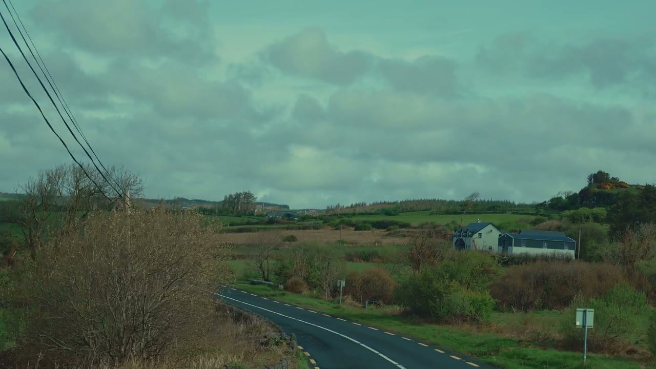 Winding Rural Road Through Fields