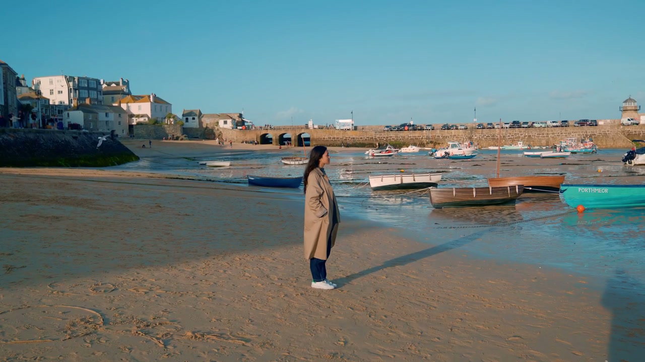 Woman Standing on St Ives Harbour Beach