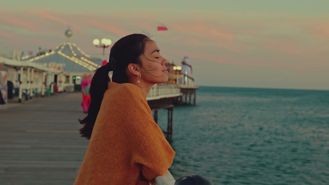 Person Enjoying Sunset View on Brighton Pier