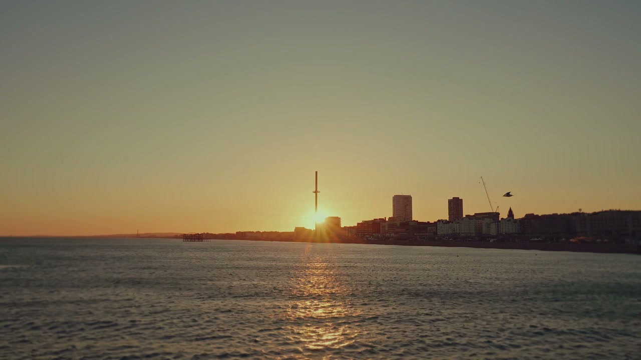 Brighton Seafront Sunset with Pier and Cityscape