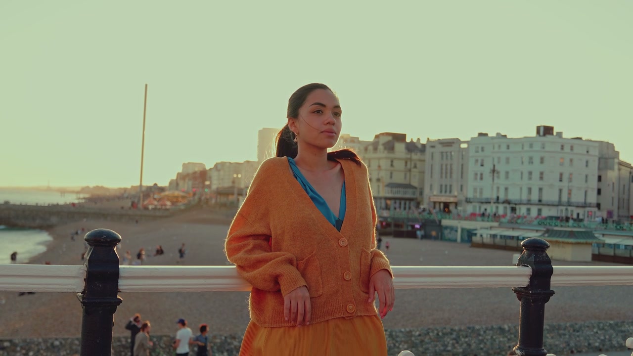 Woman on Brighton Pier at Sunset