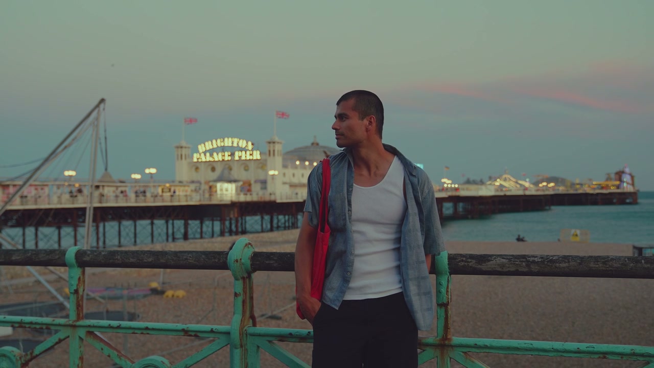 Man on Brighton Pier at Dusk