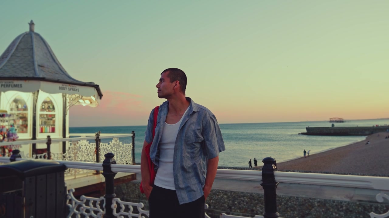 Man on Brighton Pier at Sunset