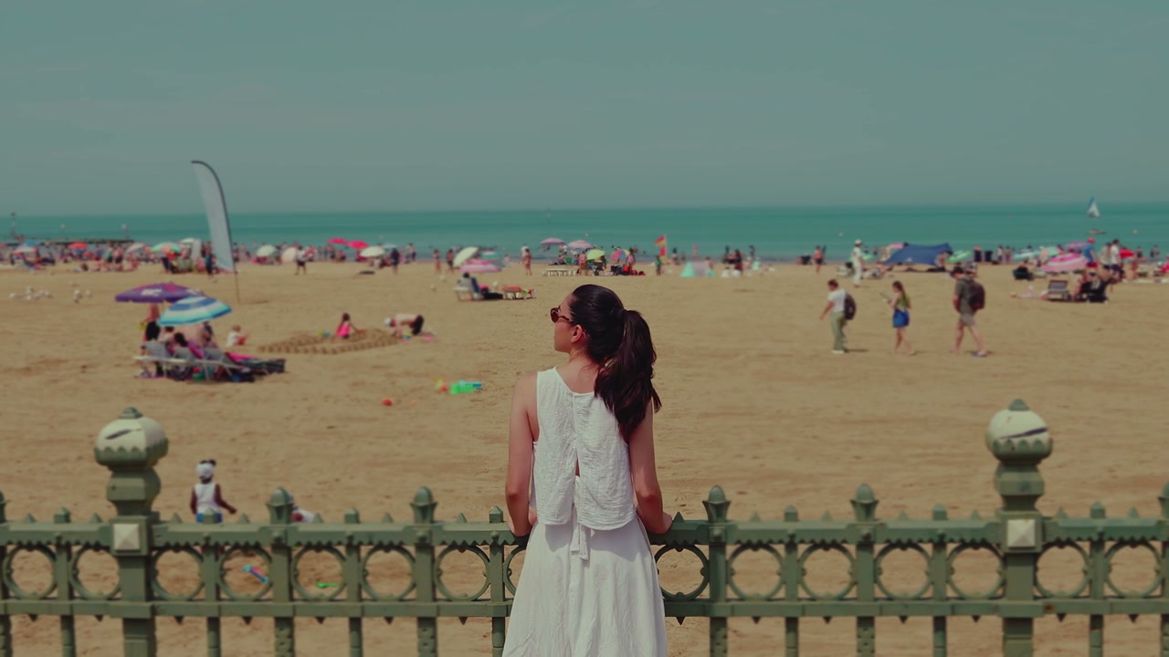 Woman on Margate Promenade Overlooking Beach