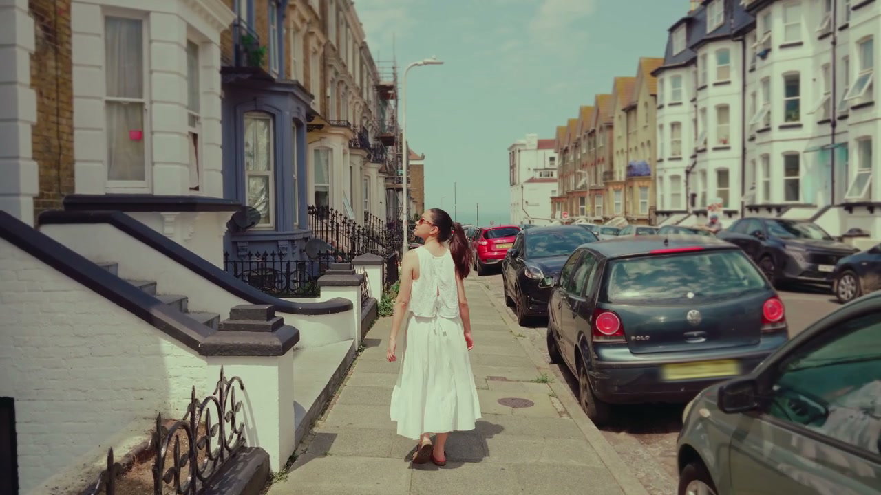 Woman Walking Along Margate Residential Street