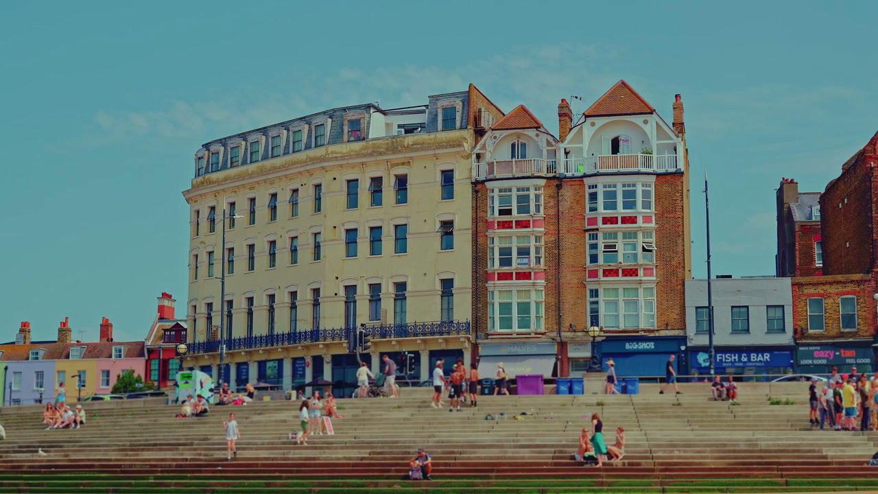 People Relaxing on Steps in Margate