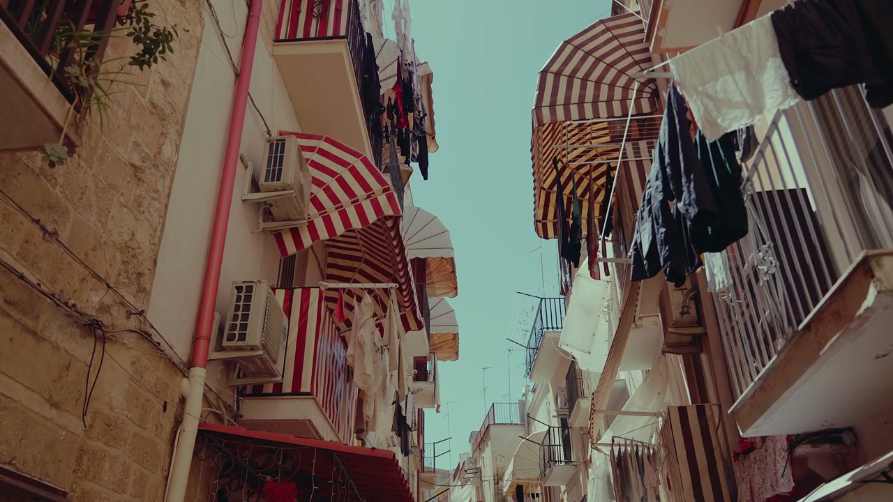Matera Street with Drying Laundry and Awnings