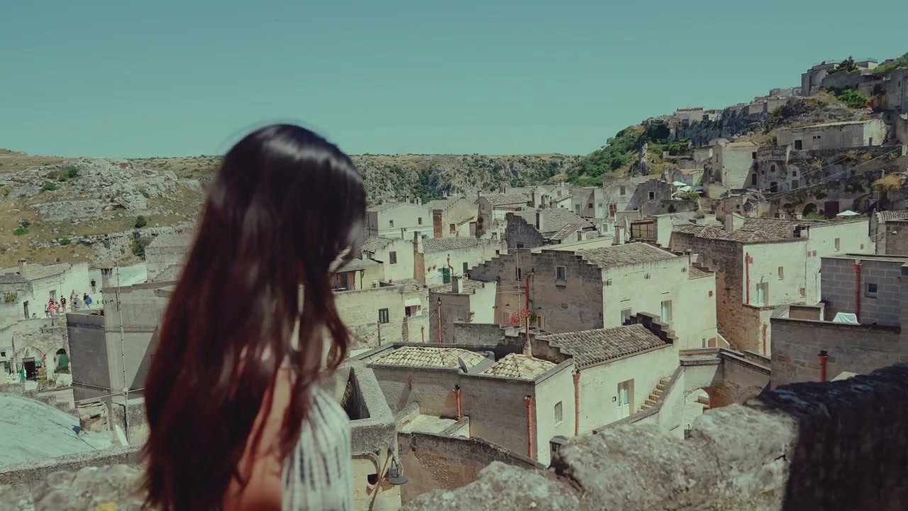 Person Looking Over Matera Cityscape