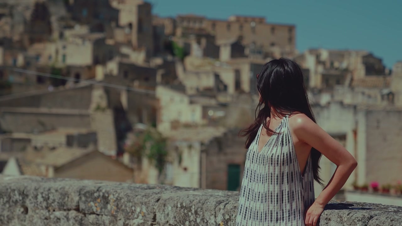Woman Overlooking Ancient City of Matera