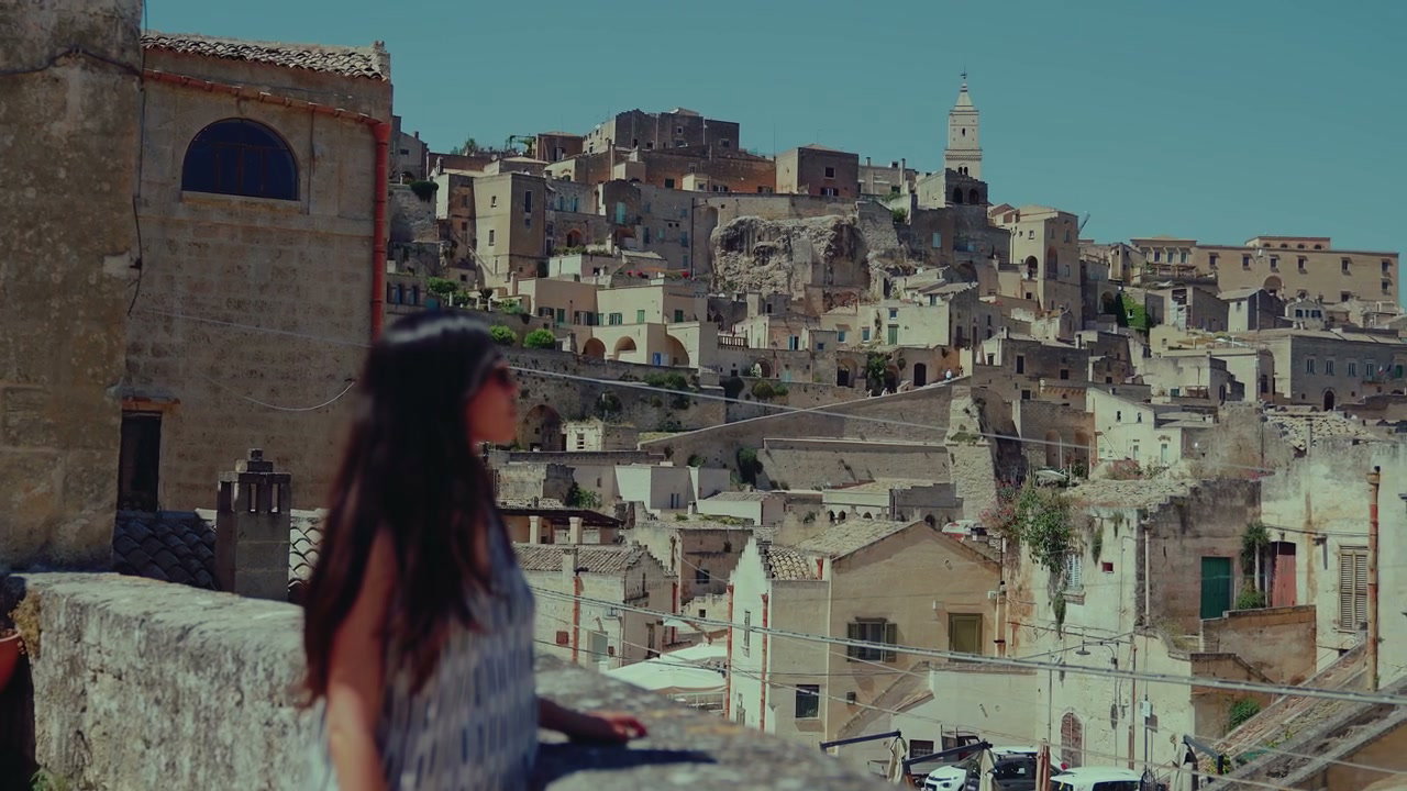 Matera Cityscape with Woman on Balcony