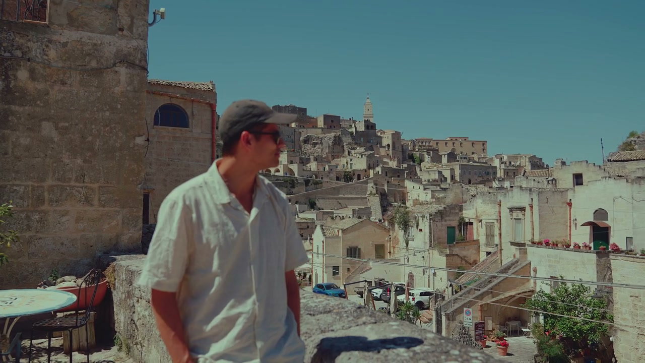 Man Overlooking Matera Ancient Cityscape