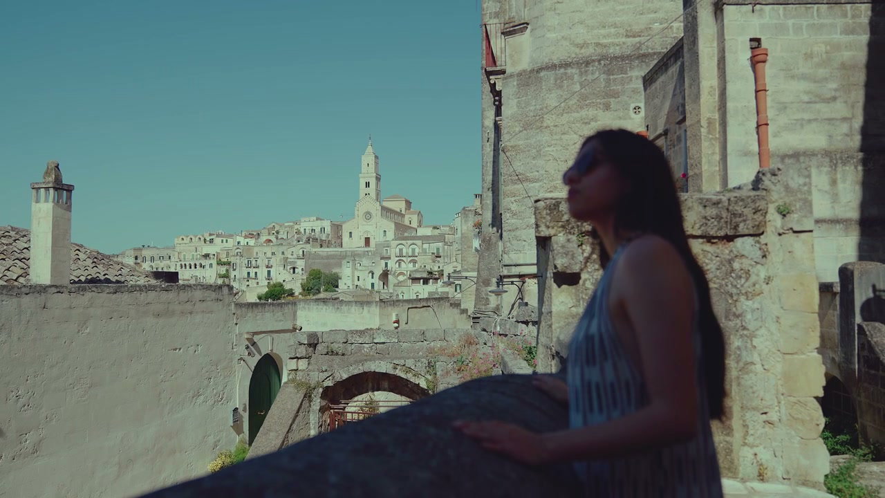 Woman Looking Over Historic City of Matera