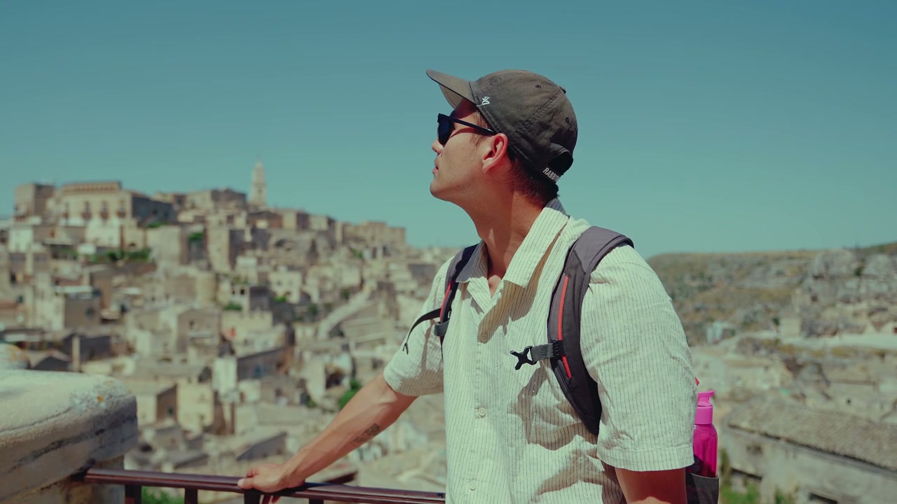 Tourist Admiring View of Matera Old City